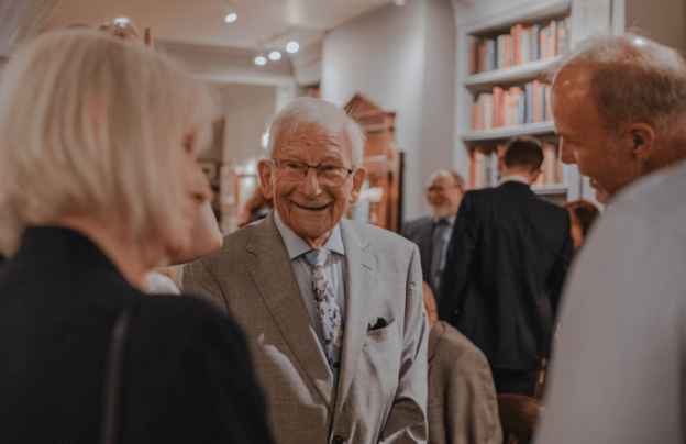 Seniors smiling at an event