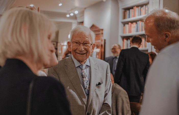 Seniors smiling at an event