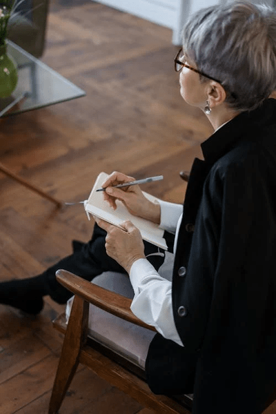 A caregiver engaging with a senior resident during dementia care in a retirement village.