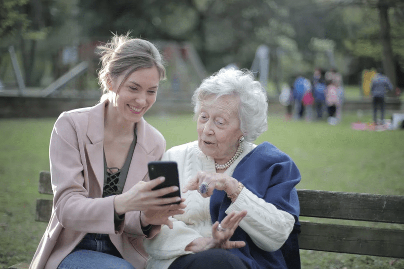 A senior engaging in an activity with a caregiver