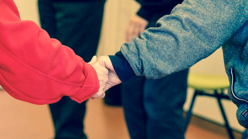 two people holding hands