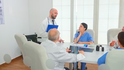 A picture of a group of support workers in a meeting