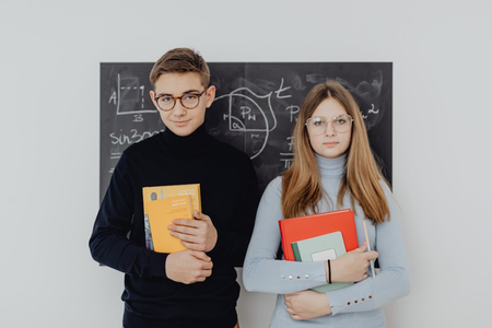 girl and a boy in glasses