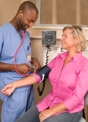 A healthcare worker ensuring care compliance.