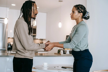  A person holding another’s hand