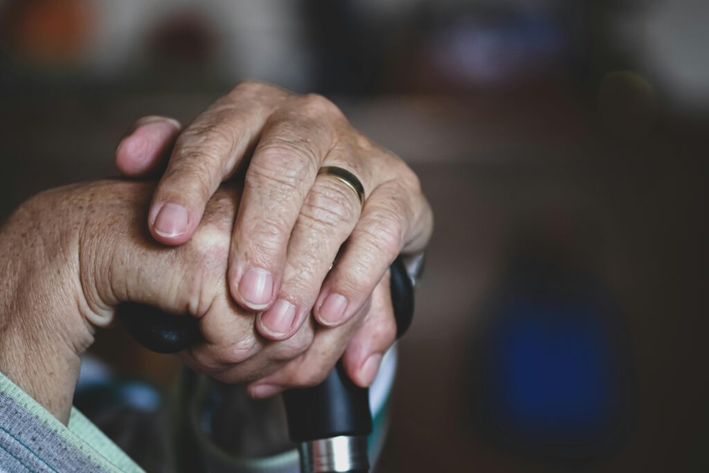 Close-up of the hands of an elderly person resting calmly