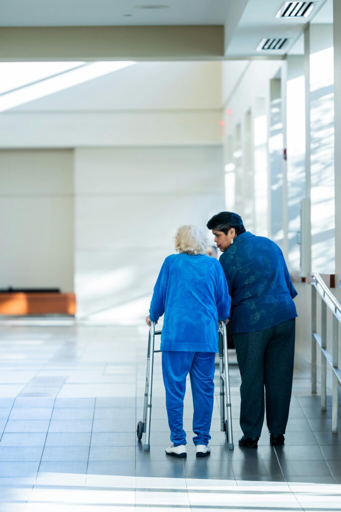 a support worker assisting an older resident with daily activities