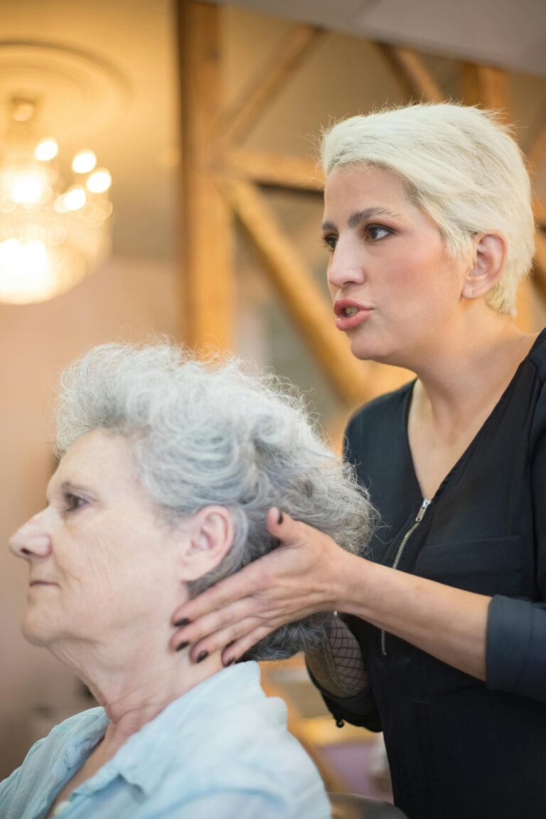 a care worker demonstrating safe techniques to an elderly woman