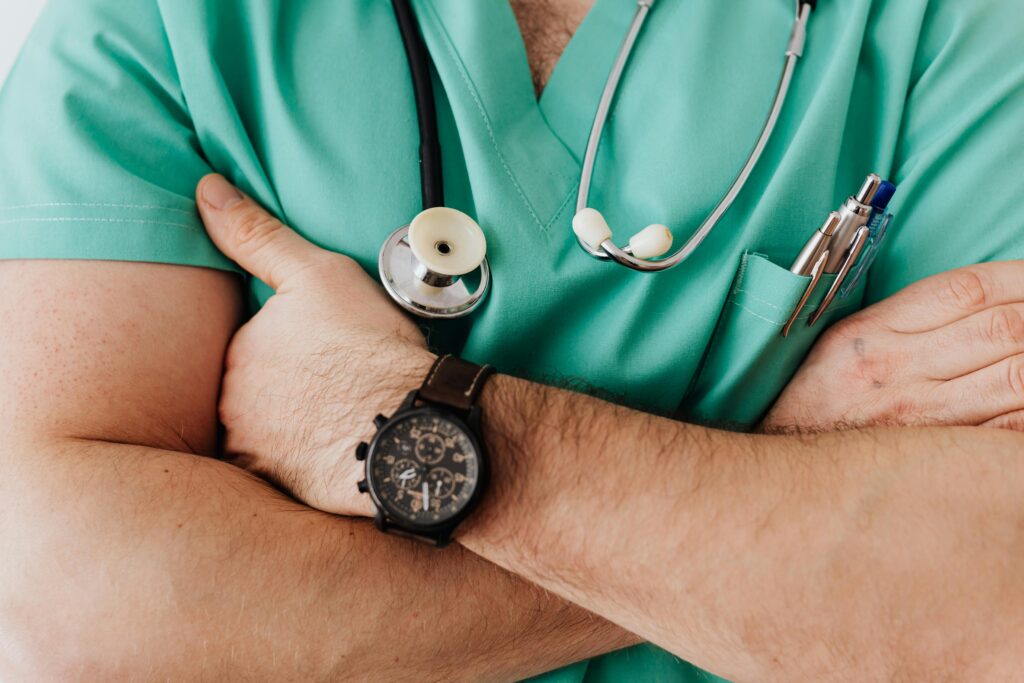 Close-up of a physician wearing a stethoscope around his neck
