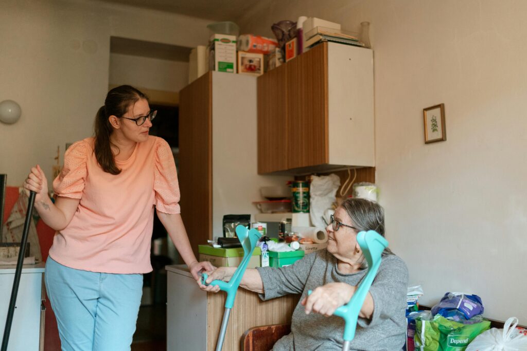 Support worker assisting a senior in a home care setting