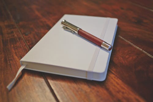 A pen on top of a diary