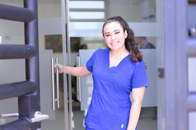 A photo showing a support worker smiling