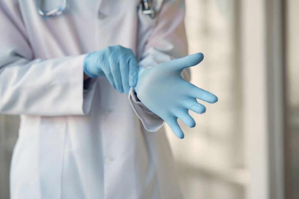 An image of a person wearing blue gloves
