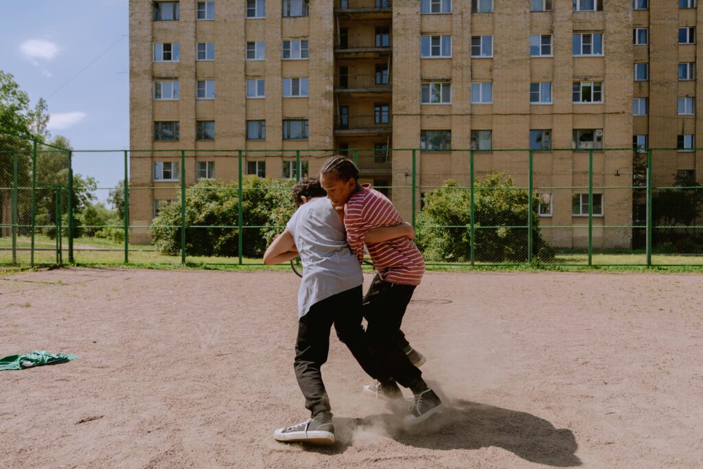 Two teenage guys fighting