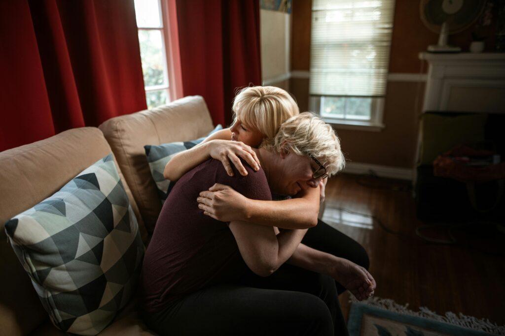 An image of two women embracing each other