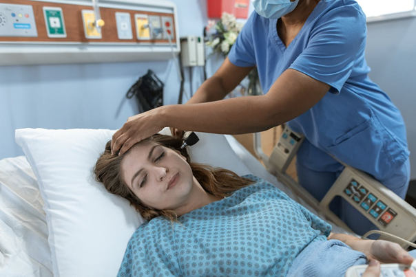 A support worker checking a patient