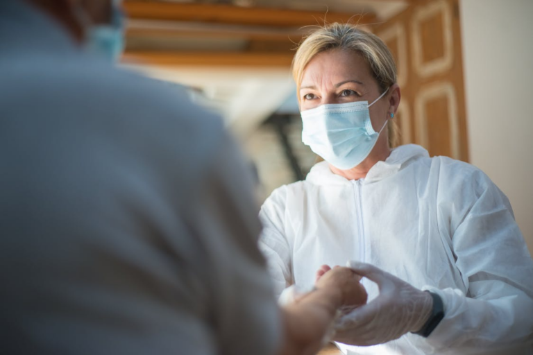 A support worker wearing a face mask