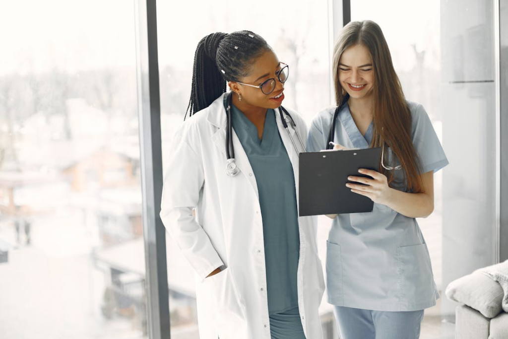 Two care professionals looking at a document