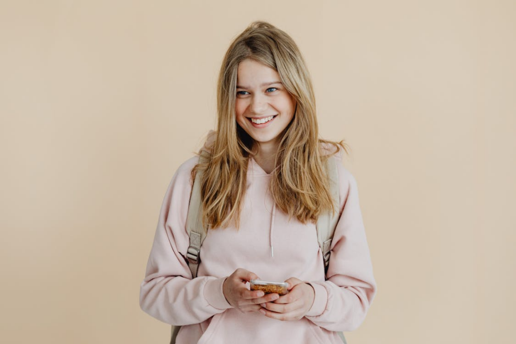 A teen smiling