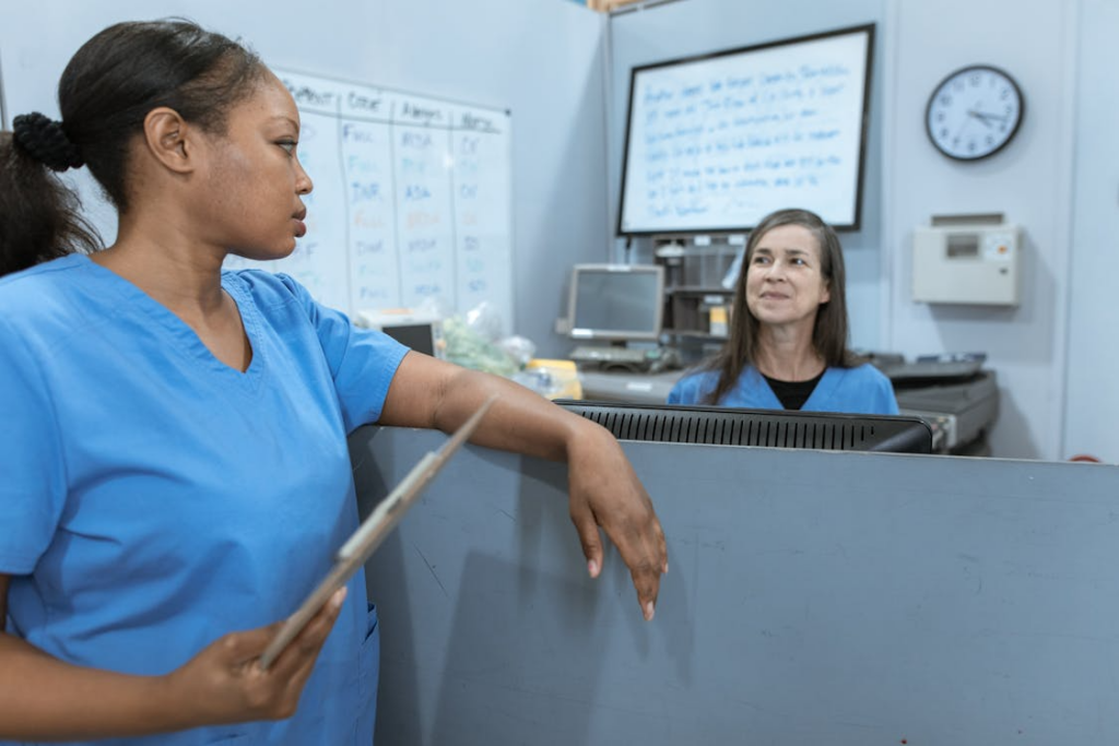 Two support workers conversing