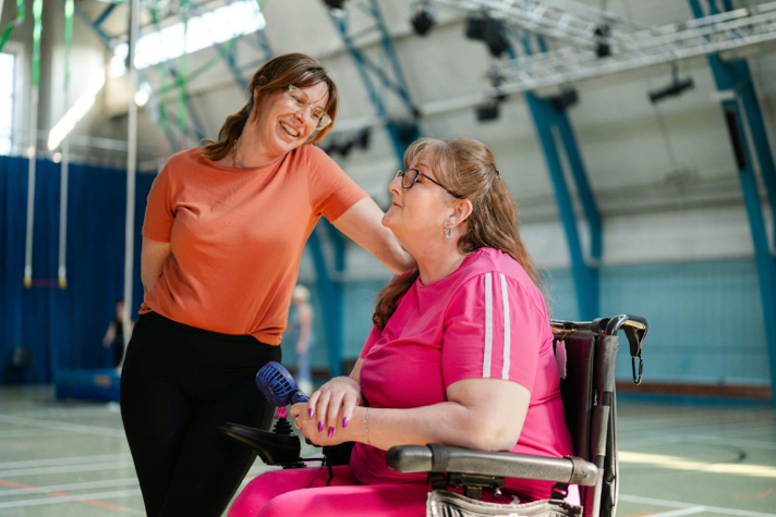 Support worker engaging with a service user during a community activity