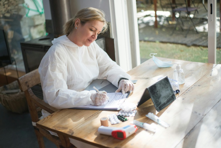 Support worker completing care documentation in a residential home
