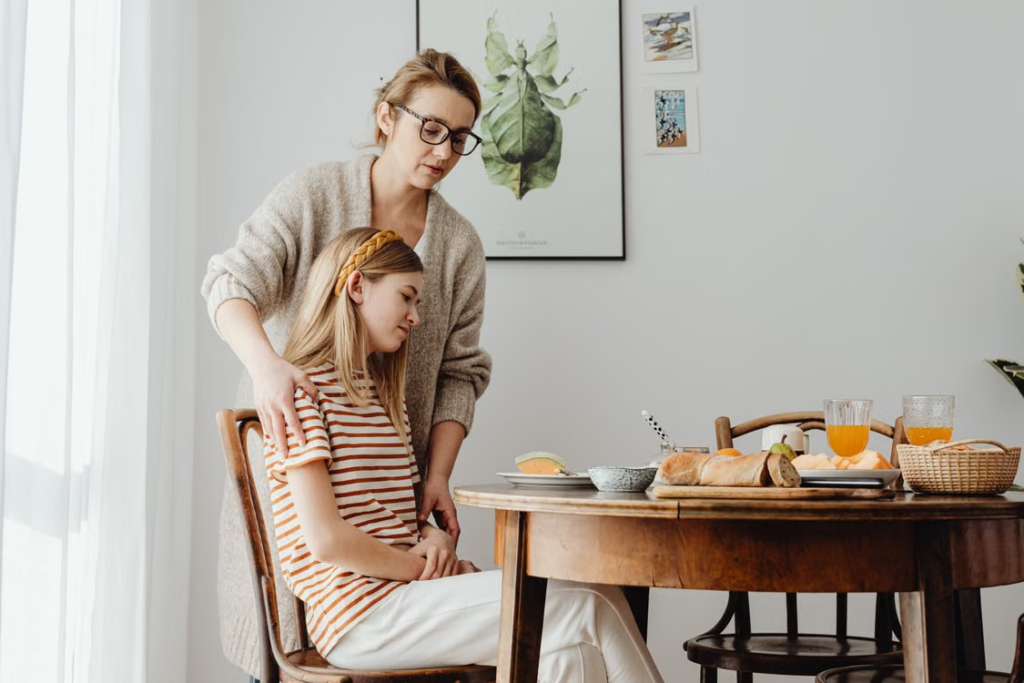 A support worker helping a teen 