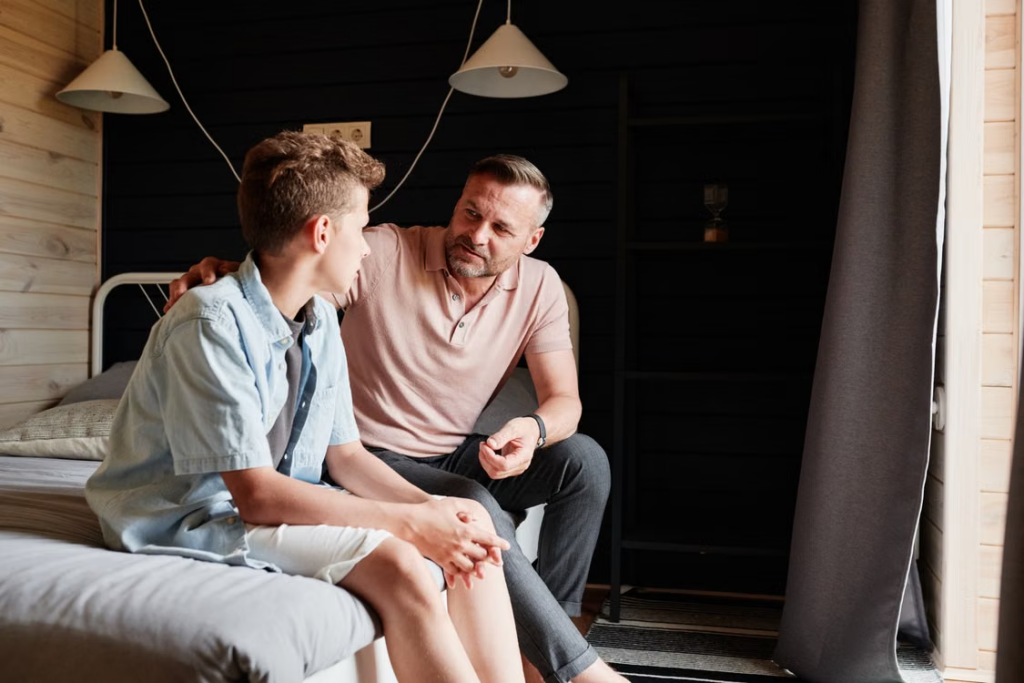 A person talking to a teen