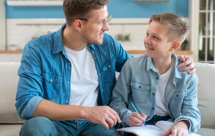 Support worker and young person interacting positively in care home setting