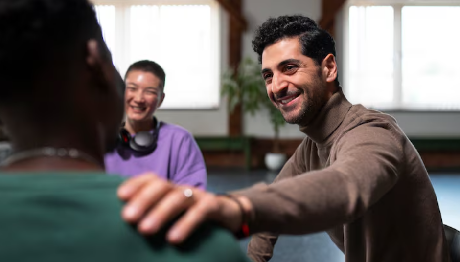 Support worker calmly engaging with teenager in residential care environment
