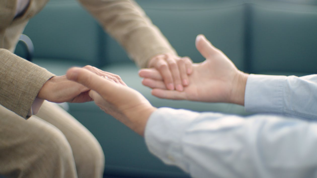  An image of two people holding hands 