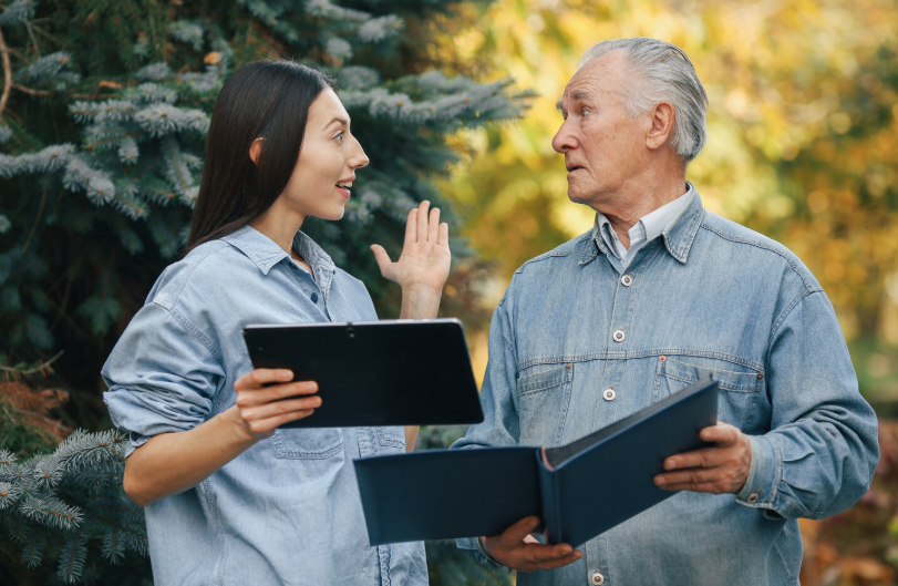  Support workers and manager reviewing care documentation during inspection process