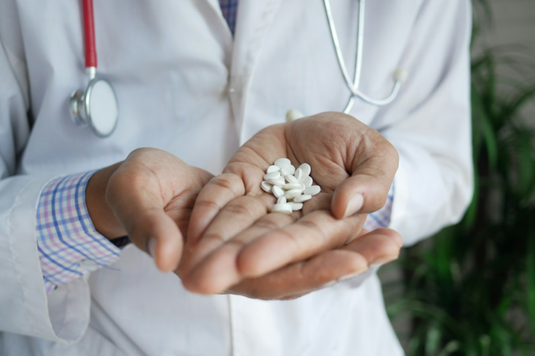 An image of a person holding pills in their hand