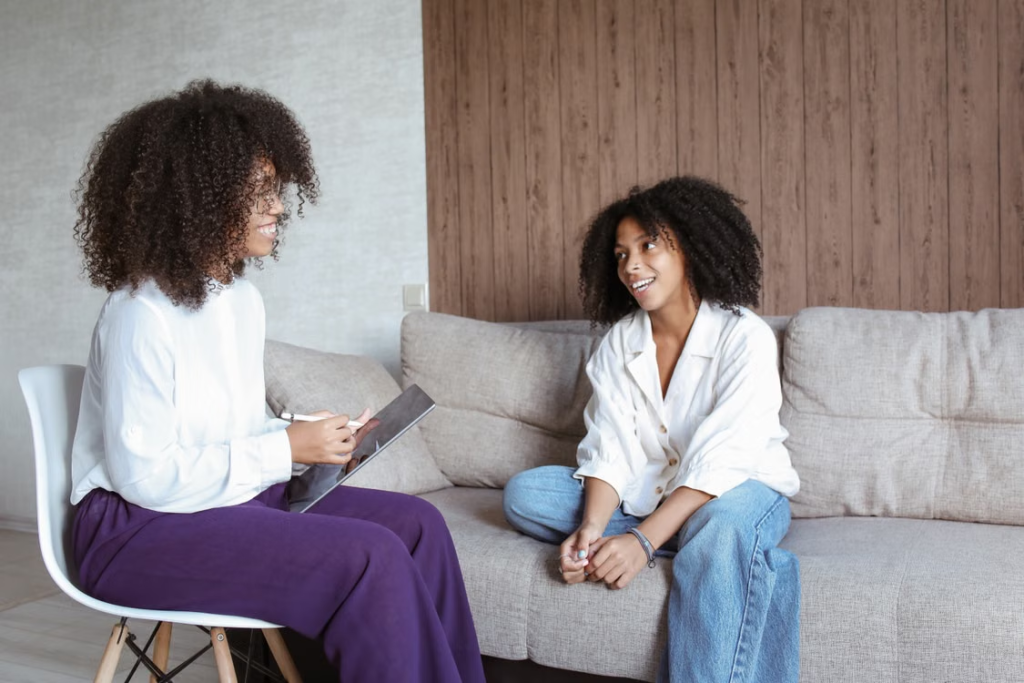 A teenager talking to a residential child care professional 