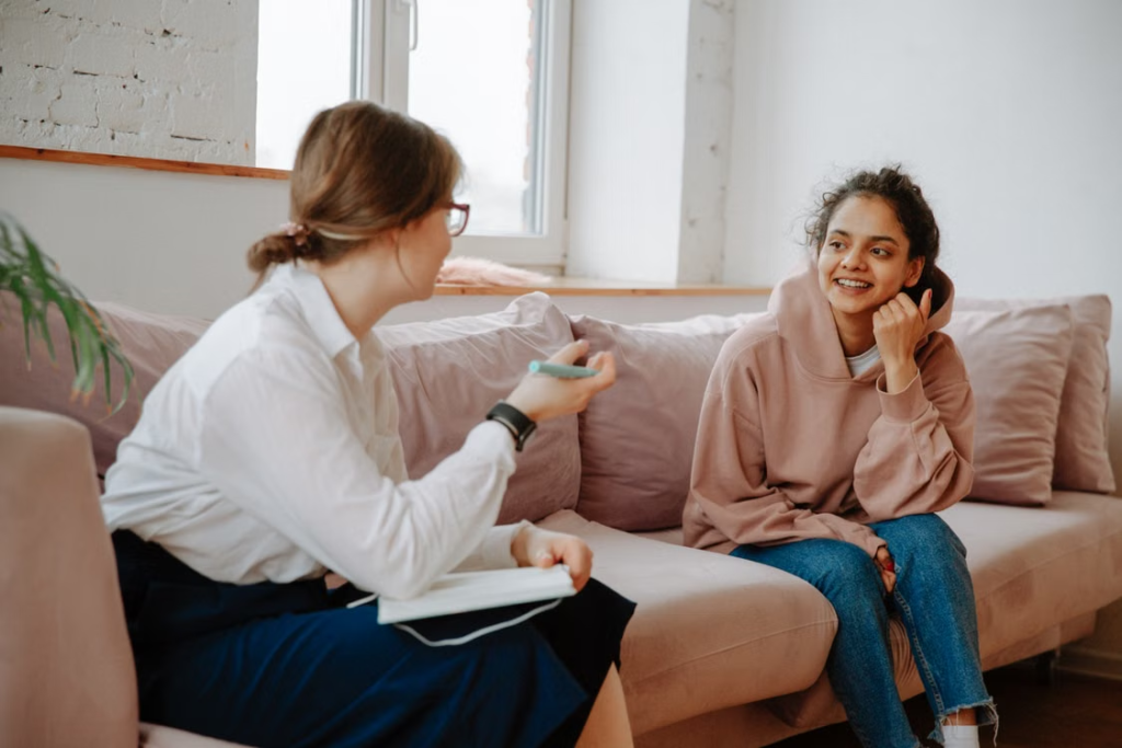 A professional talking to a teen 