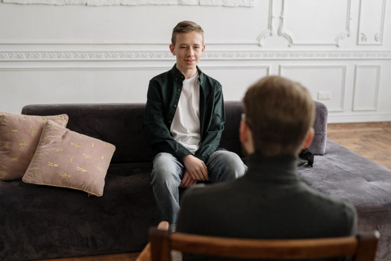 Residential childcare professional supporting a young person.