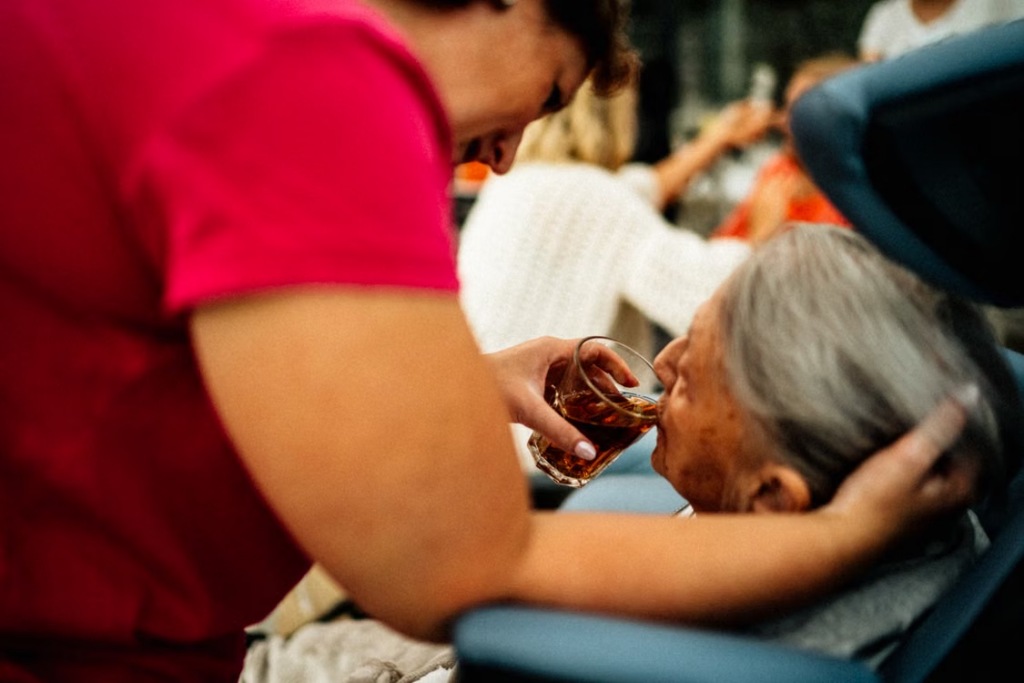 Support worker assisting a senior resident.