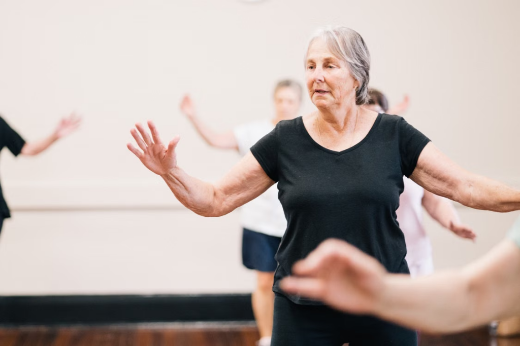 Senior residents taking part in a group exercise session at a retirement village