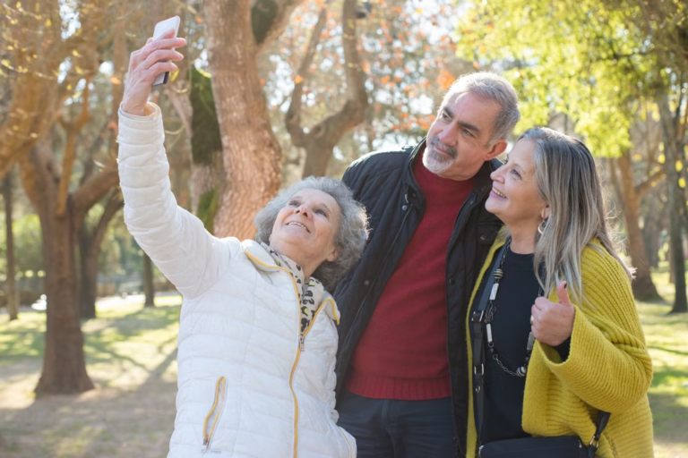 A group of older adults taking a selfie