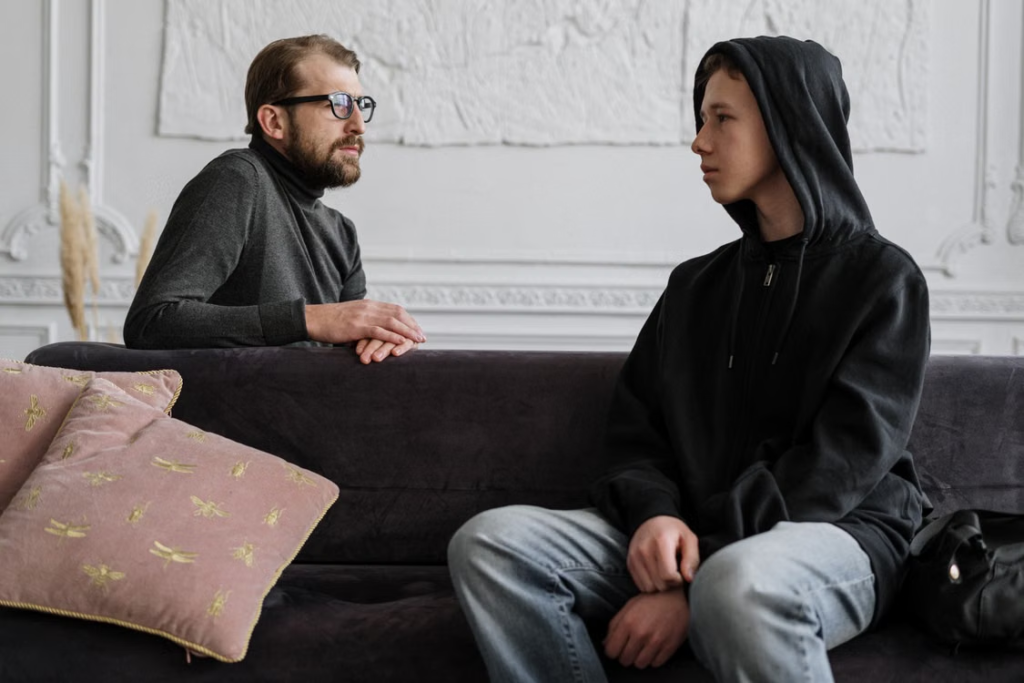 A professional talking to a teen 